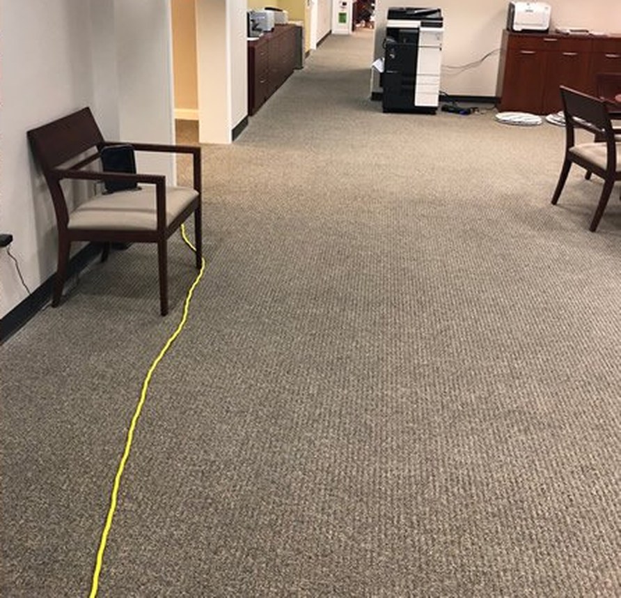 The same office hallway carpet freshly cleaned and even-toned